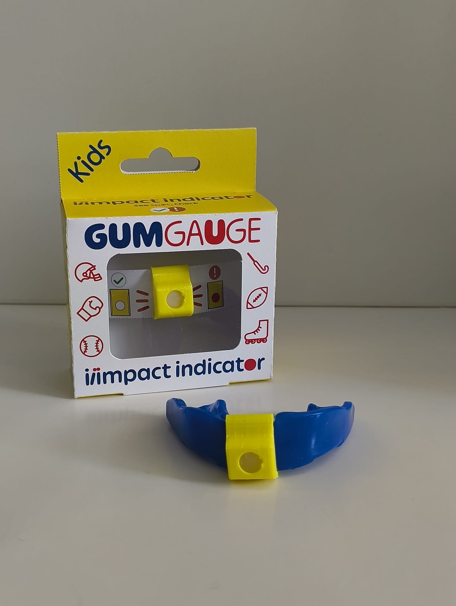 GumGauge Kids — yellow packaging with blue mouthguard and impact indicator